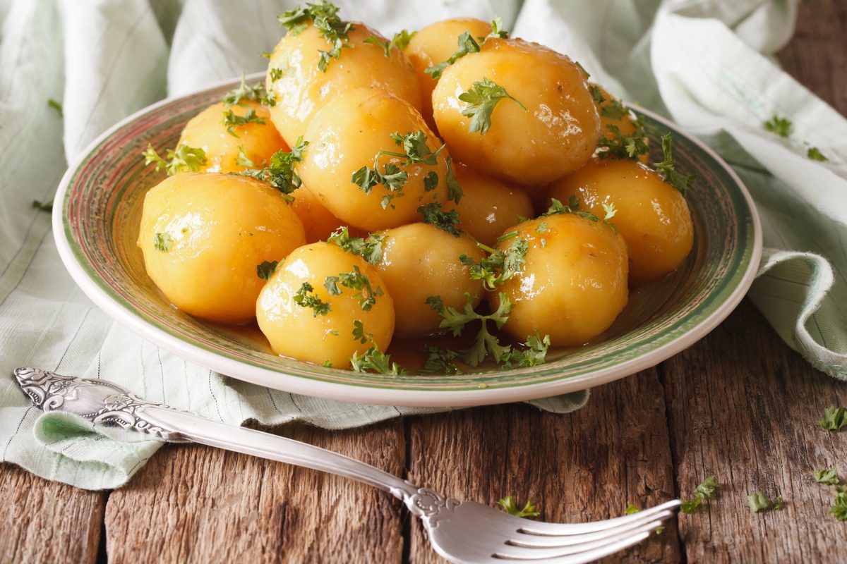 Caramelized small potatoes with parsley in a bowl