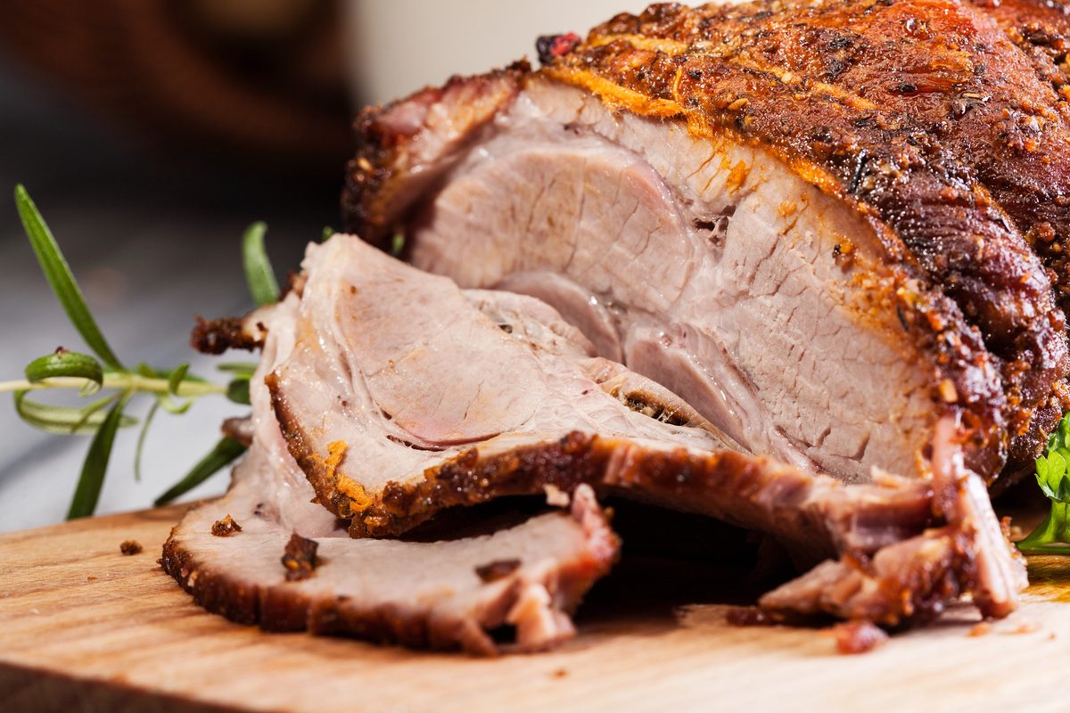Roast lamb shoulder on a cutting board
