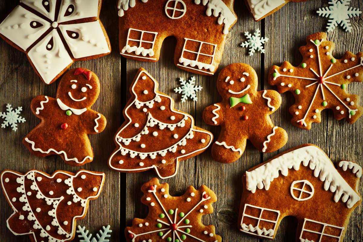 Decorated Christmas gingerbread cookies in the shapes of trees, men and houses