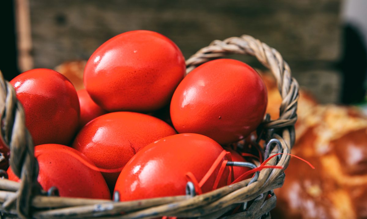 Red-dyed Easter eggs in a wicker basket