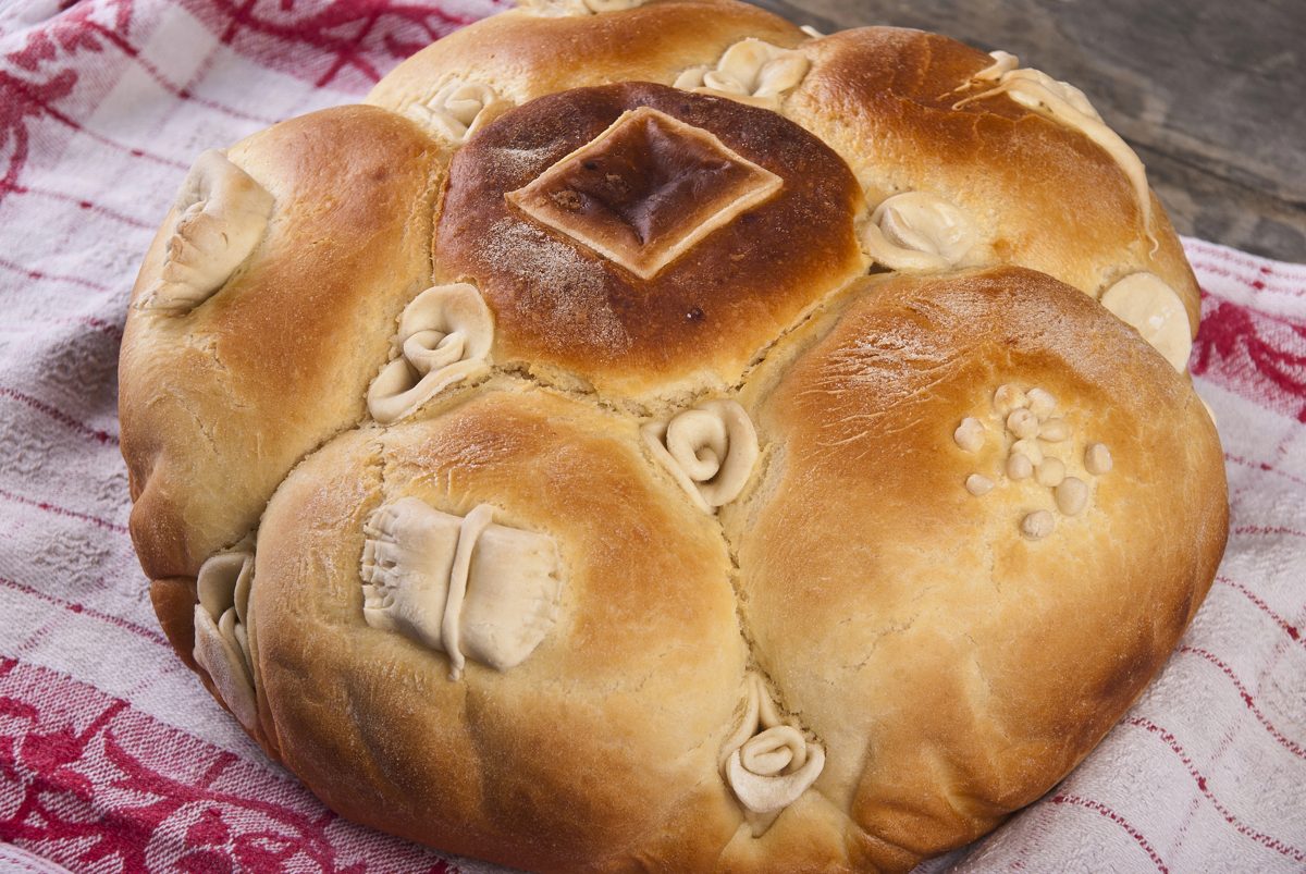 Round braided Serbian Easter bread with dough decorations