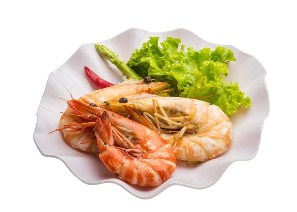 Boiled king prawns on a plate with salad