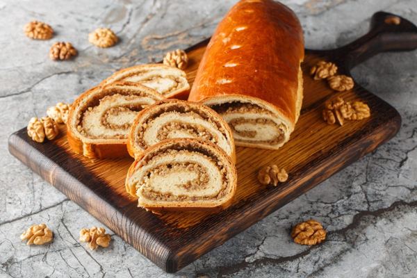 Orehnjača walnut roll, sliced to show the swirl of walnut filling