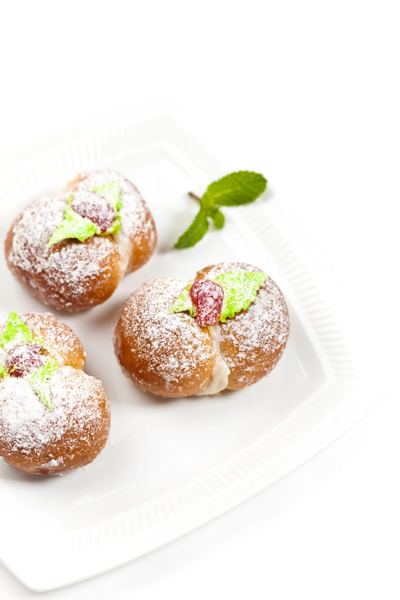 Breskvice, peach-shaped cookies rolled in sugar with mint leaves