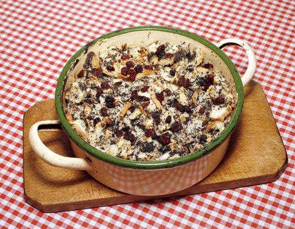 Mákos guba, bread pudding with poppy seeds, in a ceramic dish