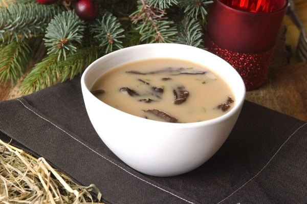Creamy wild mushroom soup in a white bowl