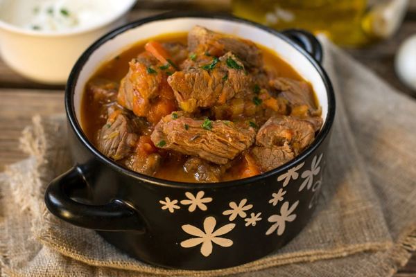 Paprika lamb stew in a black pot