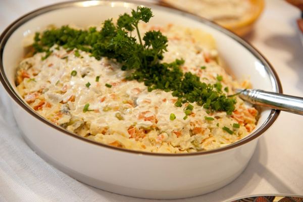 Polish vegetable salad with mayonnaise and parsley