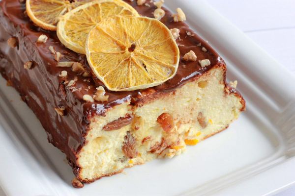 Galician cheesecake with chocolate glaze and dried orange slices