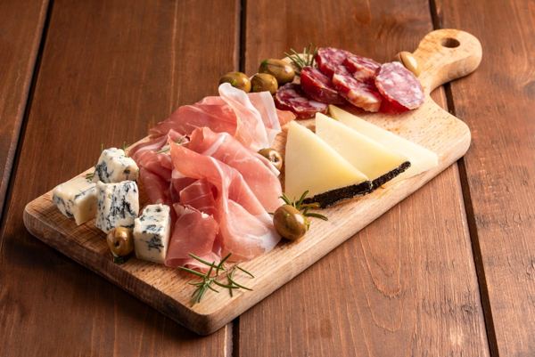 Board with prosciutto, cured meats and cheese