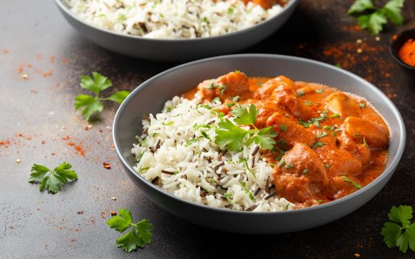 Chicken paprikash in a bowl with rice