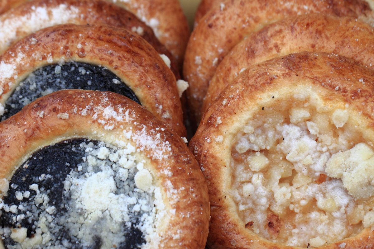 Round Czech koláče with poppy seed and sweet cheese filling